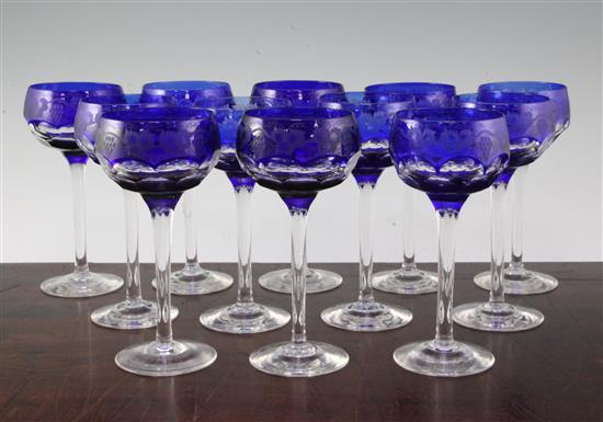 A set of twelve John Walsh blue flashed cut champagne glasses, 17cm